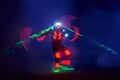 Laser show performance, dancers in led suits with LED lamp, very beautiful night club performance, party Royalty Free Stock Photo