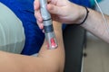 Laser therapy in hand used to treat pain.