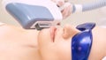 Laser unwanted hair cosmetology procedure. Beautiful young girl. Blue glasses. Face treatment. IPL machine