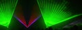 Lasershow festival disco party background banner panorama - Colorful outdoor laser show with rays streams and crowd silhouette of