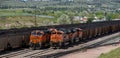 9111 and 9086 lashup and 6271 and 5660 lashup diesel locomotives head eastbound loaded coal trains Royalty Free Stock Photo