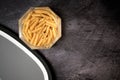 glass jar with macaroni pasta open on a dark background and a gra Royalty Free Stock Photo