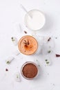 Lassi is a chocolate cold drink next to ingredients