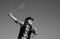 Lasso throwing. Old wild west cowboy with rope. Bearded western man with brown jacket and hat catching horse or cow. Royalty Free Stock Photo