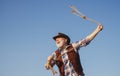 Lasso throwing. Old wild west cowboy with rope. Bearded western man with brown jacket and hat catching horse or cow. Royalty Free Stock Photo