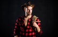 Lassoing on prairie. Man unshaven cowboy black background. Cowboy wearing hat hold rope. Lasso tool of American cowboy Royalty Free Stock Photo