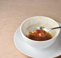 Last bite from bowl of Hot garden vegetable soup, spoon, and who Royalty Free Stock Photo