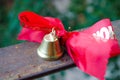 Last call. A bell with a red ribbon. Spring holiday. School years. Graduation. School bells on the background of green