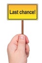 Last chance sign in hand.