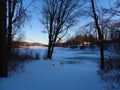 Sunset approaches over Dryden Lake with sunlight illuminating far eastern hilltops. Royalty Free Stock Photo