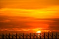 last light of sunset on sky and silhouette metal fench  of prison Royalty Free Stock Photo