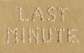 Last minute written in sand Royalty Free Stock Photo