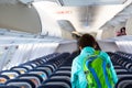 Last passenger, young adult woman leaving an airplane Royalty Free Stock Photo