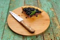 Last piece of homemade open pie decorated with fresh forest blue Royalty Free Stock Photo