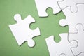 the last piece of jigsaw puzzle missing on green background to complete the mission Royalty Free Stock Photo