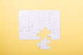 Last piece jigsaw White puzzle Concept success of business Yellow background Royalty Free Stock Photo