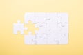 Last piece jigsaw White puzzle Concept success of business Yellow background Royalty Free Stock Photo