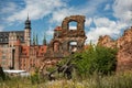 Last post war remains in Gdansk, Danzig, Poland. View through ruins to the old town. Granary Island Royalty Free Stock Photo