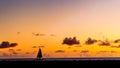 Last rays of an Ala Moana sunset with a lone sailboat Royalty Free Stock Photo