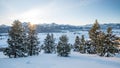 Last rays of evening sun shine on a winter valley covered with snow in Idaho Royalty Free Stock Photo