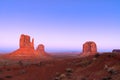 The last rays of the setting sun illuminate famous Buttes of Monument Valley on the border between Arizona and Utah, USA Royalty Free Stock Photo