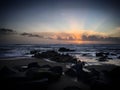 Last rays of the sunset over the rocky coast of the Atlantic Ocean near Miramar, Arcozelo, Porto, Portugal, January 2018 Royalty Free Stock Photo