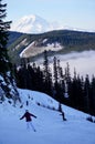 Last Run of the day: Skiers & Snowboarders & Mt. Rainier seen from White Pass, WA Royalty Free Stock Photo