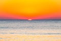 The last seconds of the amazing sundown behind the sea horizon. A bit of the sun star sphere showing up above the Tyrrhenian sea Royalty Free Stock Photo