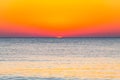 The last seconds of the amazing sundown behind the sea horizon. A bit of the sun star sphere showing up above the Tyrrhenian sea Royalty Free Stock Photo