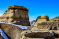 Last snow of the year clings to Hoodoos. Drumheller, Alberta, Canada Royalty Free Stock Photo