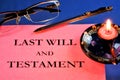 The last will and Testament, an act of unilateral will, is notarized. On the table is a blank document, glasses and a pen for Royalty Free Stock Photo