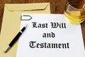 Last Will and Testament and glass of whiskey