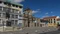 Bricklayers working on the facade of Colegio La Salle next to the church of San Francisco in the center of the city of Latacunga