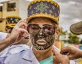 Latacunga, Ecuador - September 22, 2018 - Young men dress in decorated Black Face to celebrate African slave that saved