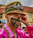 Latacunga, Ecuador - September 22, 2018 - Young men dress in decorated Black Face to celebrate African slave that saved