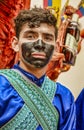 Latacunga, Ecuador - September 22, 2018 - Young men dress in decorated Black Face to celebrate African slave that saved