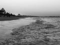 Late afternoon on the beach inside the sea, black and white photo Royalty Free Stock Photo
