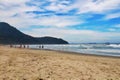 Late afternoon on a busy beach on a sunny day