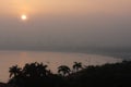 Late afternoon at Enseada beach, GuarujÃÂ¡, with the sun turning pink in the fog, Brazil