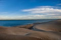 The late afternoon sun casts shadows across the sand dunes at Adolfo Lopez Mateos in Baja California