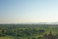 The late afternoon sun shines hazy over the temple plains of Bagan in Burma Royalty Free Stock Photo