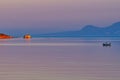 Sunset Highlighting Small Rocky Islet, Greece
