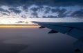 Late afternoon view of aircraft wing and setting sun Royalty Free Stock Photo