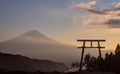 A torii gate and Mount Fuji under an autumn sunset Royalty Free Stock Photo