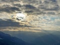 Late-afternoon winter clouds with the shy sun behind them and in the sky above the Swiss Alps, Weesen - Canton of St. Gallen Royalty Free Stock Photo