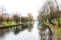 Late autumn in the city Park: Bare trees reflected in the water Royalty Free Stock Photo