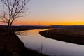 Late autumn sunset grassland near the river Royalty Free Stock Photo