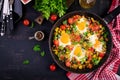 Late breakfast - fried eggs with vegetables. Shakshuka. Royalty Free Stock Photo