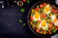 Late breakfast - fried eggs with vegetables. Shakshuka. Royalty Free Stock Photo