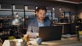 Late employee working laptop evening office closeup. Businessman reading email Royalty Free Stock Photo